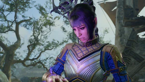 A picture of Shadowheart stading near a broken statue of Selûne in the blighted village. A wound on her hand is flaring and Shadowheart wears a look of painful surprise.